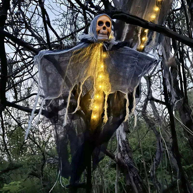 Halloween decoration of a ghostly figure with glowing lights in a forest setting