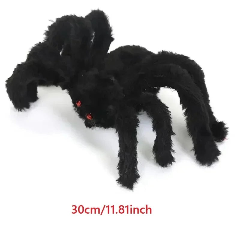 Black spider plush toy on a white background with size label