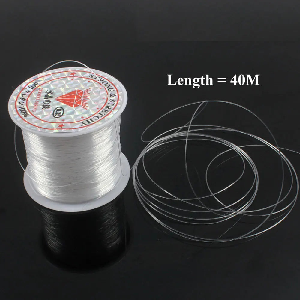 Spool of clear thread with a length of 40 meters on a black background